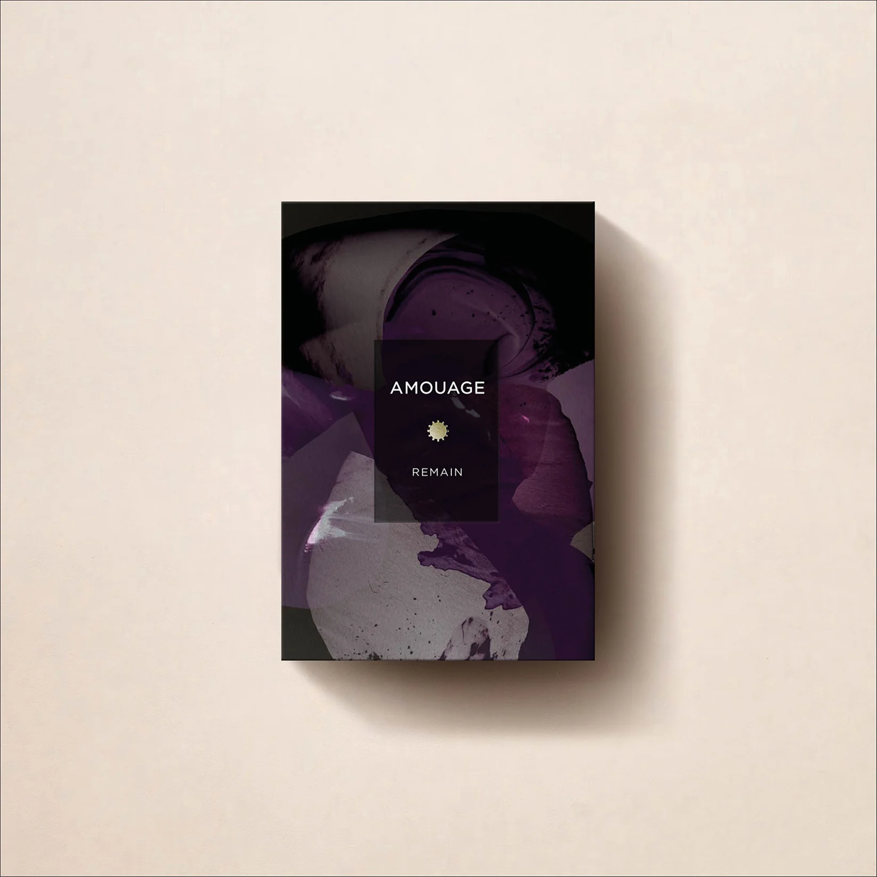 Amouage Remain perfume packaging on a beige background